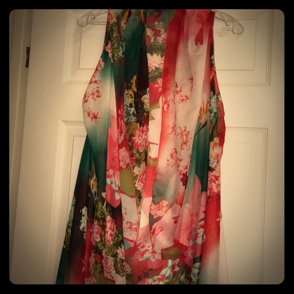 Very sheer sleeveless floral over shirt.